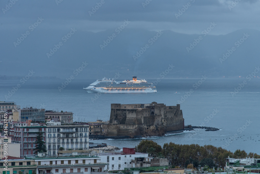 Big white cruise ship on open waters in Naples, Italy