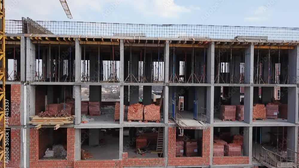 Construction site of a residential complex aerial view. Videography with a drone. Span over the construction site. Construction site of a residential complex aerial view. Videography with a drone. Span over the construction site.