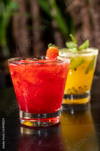Brazilian caipirinhas of various fruits in glass. Typical drink made of fruits and cachaça drink