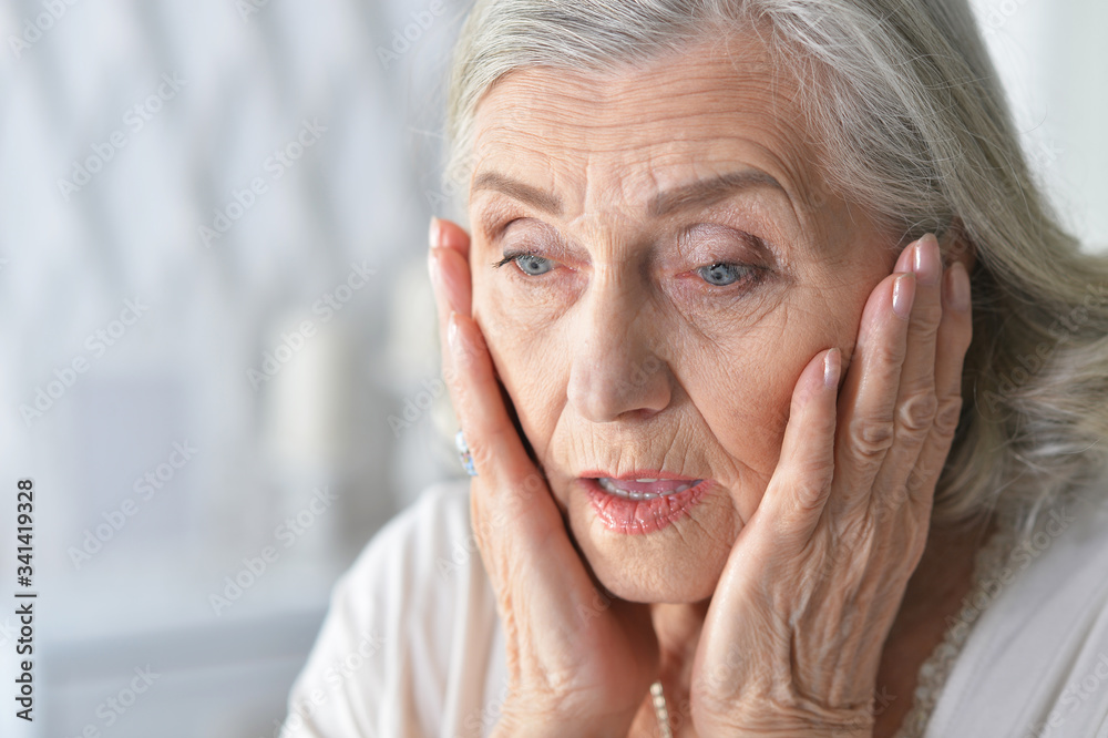 Close up portrait of sad ill senior woman Close up portrait of sad ill senior woman