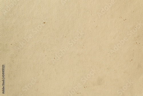Sloppy texture of old beige cardboard paper. Light vintage background.