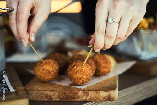 Fried Mac and Cheese balls served with ketch up, selective focus
