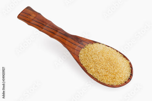 Sugar in wooden spoon isolated on white background.This has clipping path.  