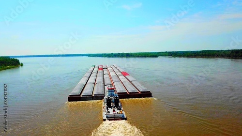 Fotografia Aerian view of a river boat in the immensity of the nature
