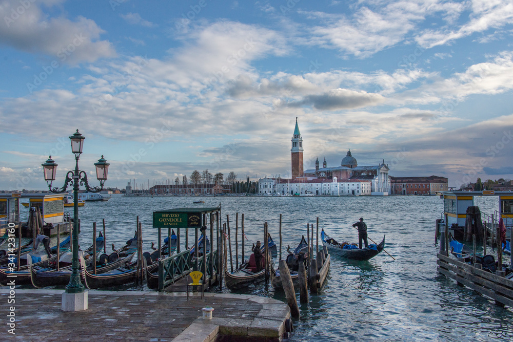 Gondolas at the San Marco square of Venice with San Giorgio Maggiore Church, Italy