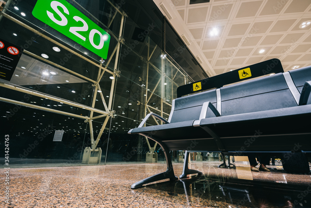 Obraz premium Empty Priority seats, chairs in the airport departure gate at international airport stoped traffic due to Coronavirus outbreak. COVID-19