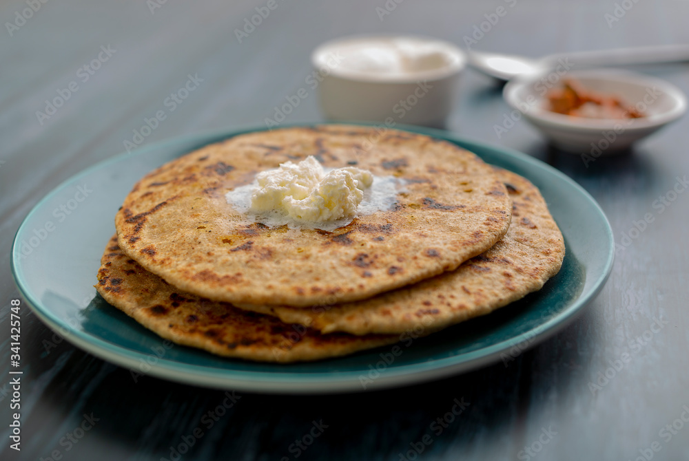 stuffed dal paratha with curd, pickle and white butter stuffed dal paratha with curd, pickle and white butter