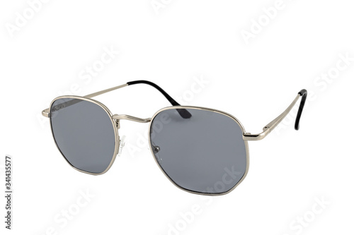 Sunglasses with square shape, wrap around, thin, silver frames. Grey color sunglasses isolated on white background. Side view.