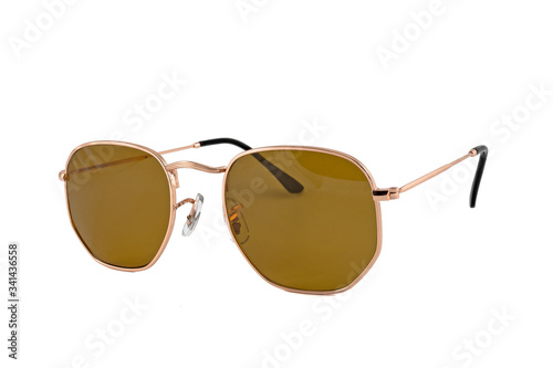 Sunglasses with square shape, wrap around, thin, gold frames. Brown color sunglasses isolated on white background. Side view.