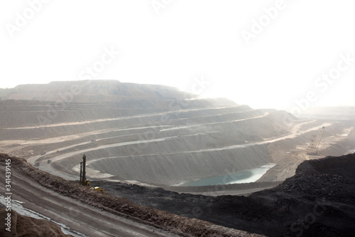 Benches in opencast coal mine photo