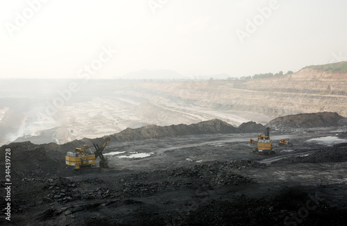 Shovels working in a opencast coal mine photo