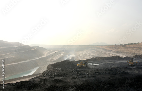 Shovels extracting coals in a opencast coal mine photo