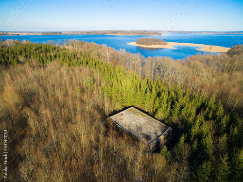 Aerial view of reinforced concrete bunkers belonged to Headquarters of German Land Forces from ww2 hidden in a forest on the Mamry Lake shore, Mamerki, Poland (former Mauerwald, East Prussia) photo