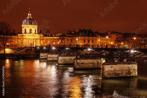 Bridge of Arts and Institute of France at night.