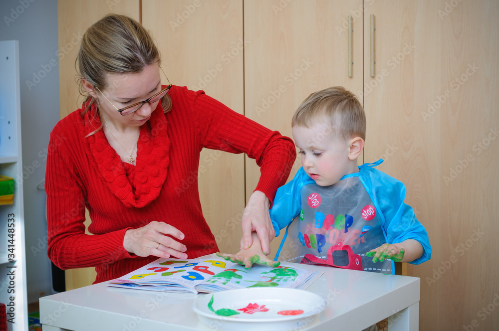 Fototapeta premium mother and son painting