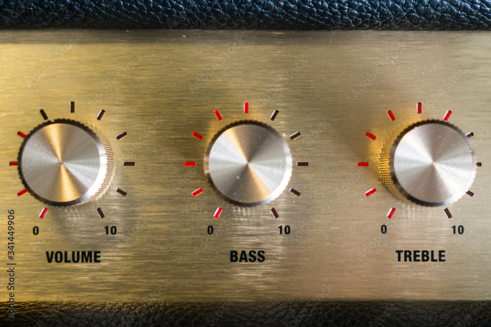 knobs of guitar amplifier in gold