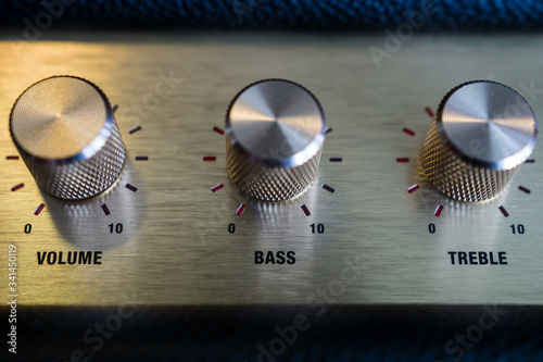 knobs of guitar amplifier in gold