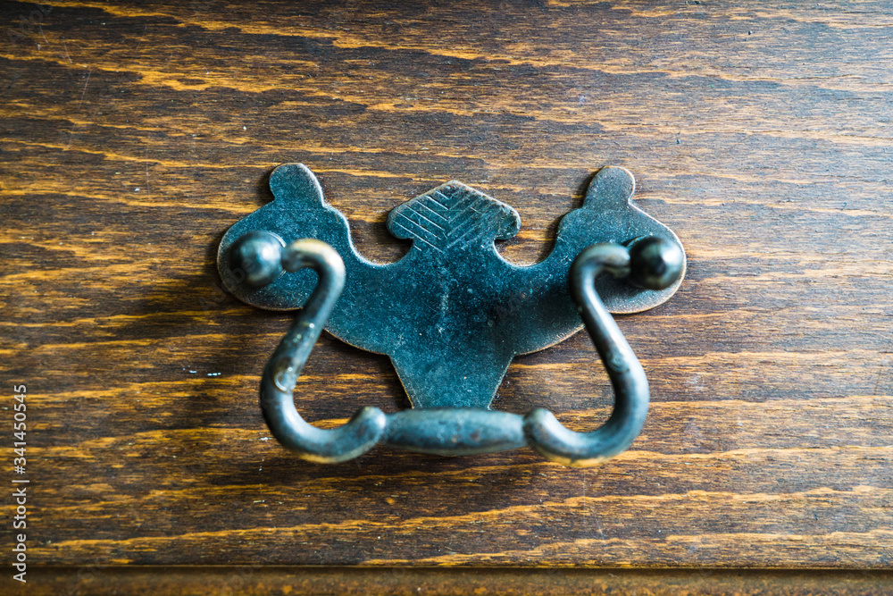 ornate handle from metal on antique funrniture