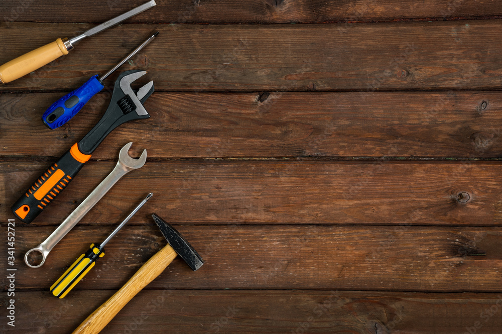 Happy Fathers Day tools, hammer on a rustic wood background. Group of repair tools on wooden background. Happy Fathers Day tools, hammer on a rustic wood background. Group of repair tools on wooden background.