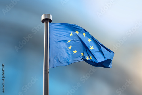 European Union flag on a blurred background.