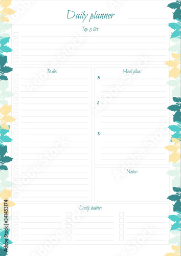 White daily planner with bright leaves design.