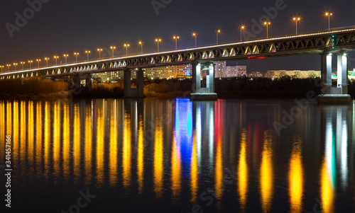 Night city lights reflected in the river. Nizhny Novgorod, the river Oka.
