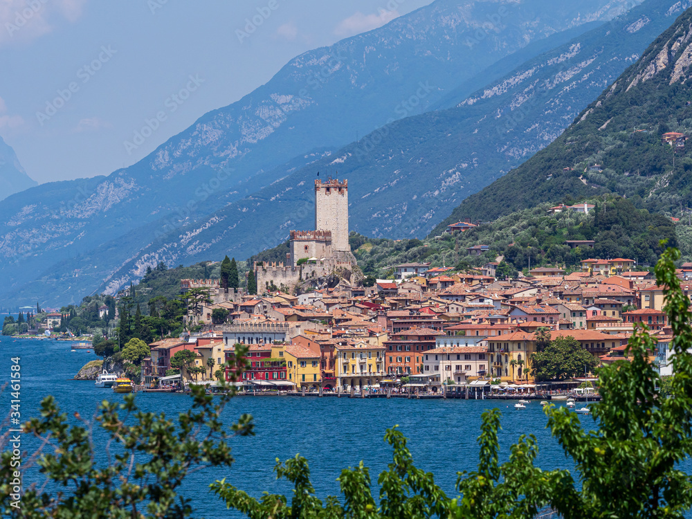Beautiful picturesque romantic Italian style village with old buildings, shore of the lake Lago di Garda