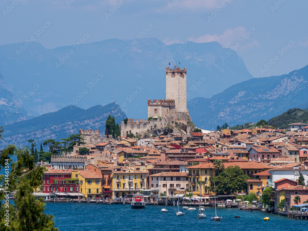 Beautiful picturesque romantic Italian style village with old buildings, shore of the lake Lago di Garda