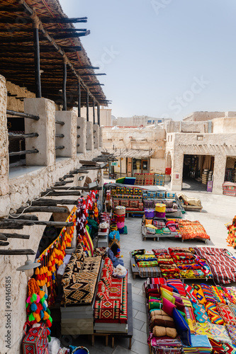 Doha, Qatar - March 2, 2020: View on traditional arabian market Souq Waqif selling carpets and clothes in Doha City