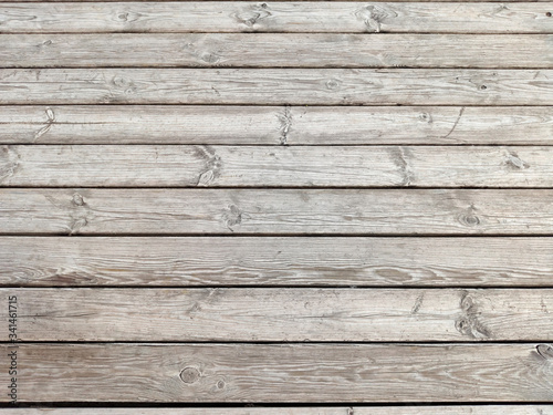 Dark dilapidated cracked boards. Wood old table. Rustic timber texture. Weathered oak planks. Interior decoration. Natural wooden background  pattern.