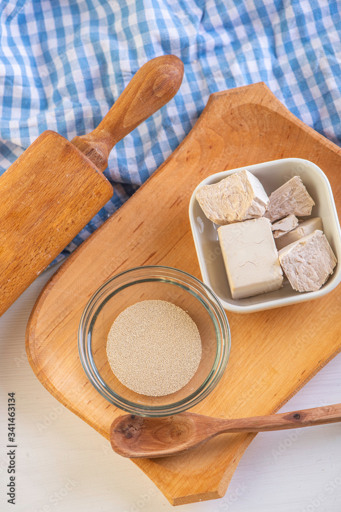 ingredients for baking Dry yeast crumbled and yeast block for baking. ingredients for baking Dry yeast crumbled and yeast block for baking.