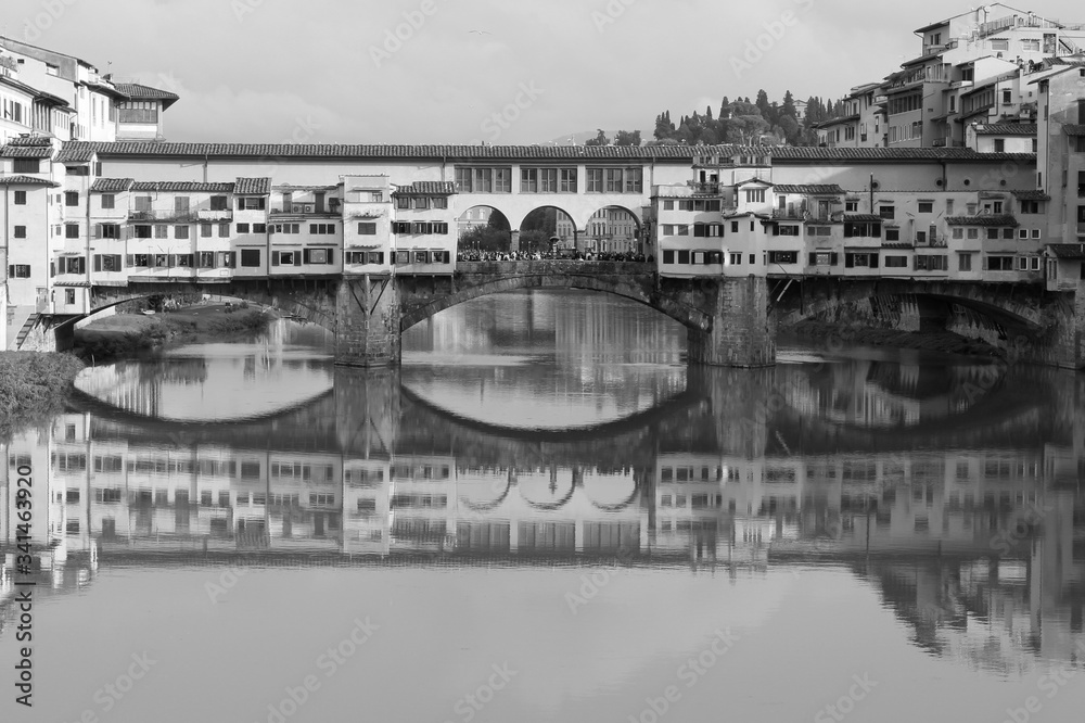 A black and white of Ponte Vecchio in Florence, Italy. In a cloudy day