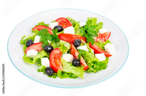 Healthy lifestyle. Vegetable diet salad with olives and goat cheese on white background.