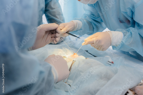 Operation in a modern operating room close-up, emergency rescue and resuscitation of the patient. Medicine and surgery