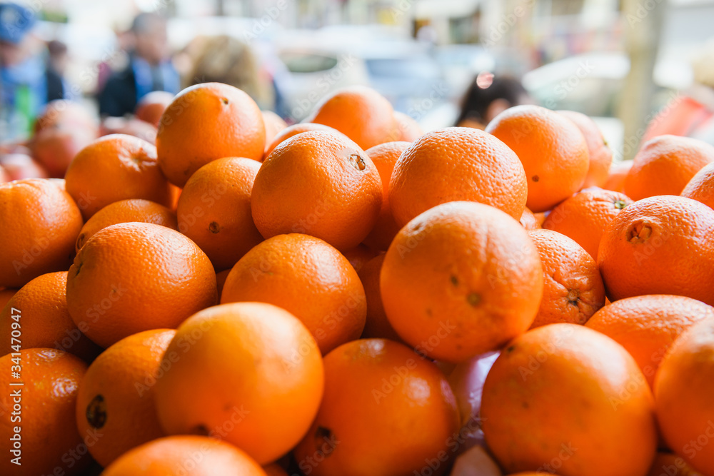 Pile of ripe oranges for sale at a market