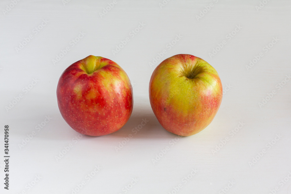 couple of apples on a white background. vitamin duo couple of apples on a white background. vitamin duo