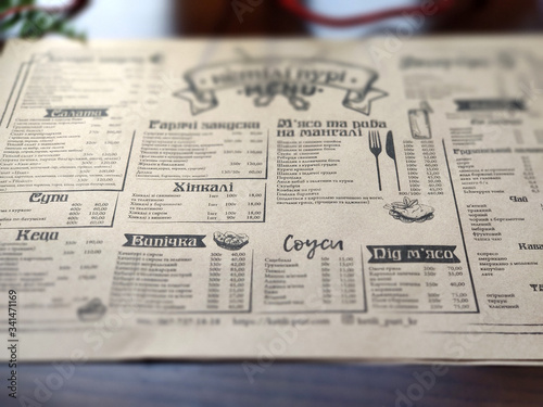 Newspaper, restaurant menu, printed products on wooden table