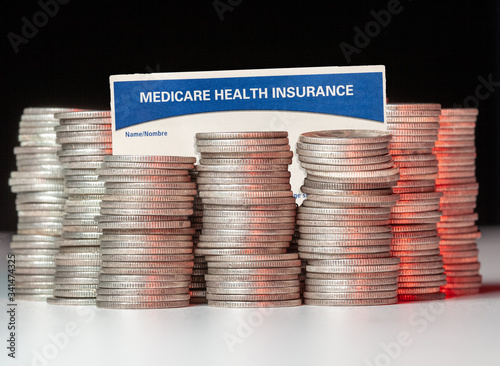 Cuadro en lienzo Many stacks of old silver dimes with medicare health insurance card to illustrat