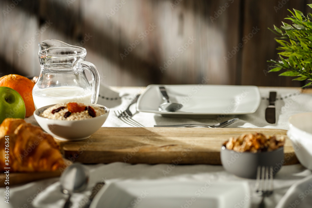 Breakfast on the table in the light of the morning sun Breakfast on the table in the light of the morning sun