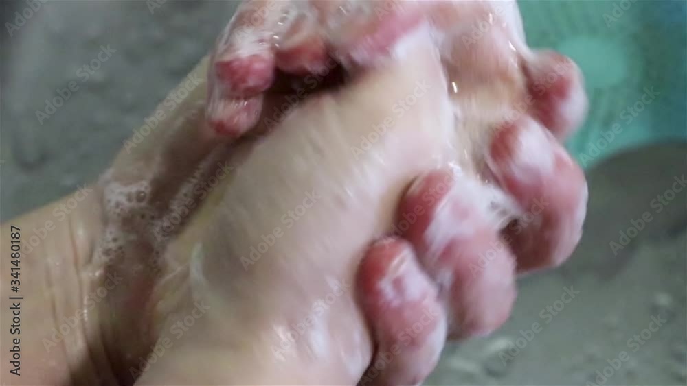 Wash hands with soap close up with metal sink and running water drops background. Cleaning body personal hygiene care Wash hands with soap close up with metal sink and running water drops background. Cleaning body personal hygiene care
