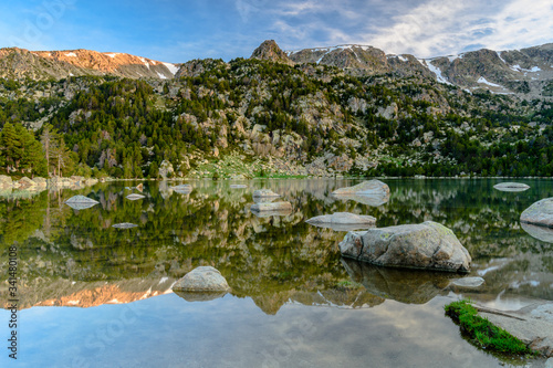 Mountain reflections in the water of Malniu Lake, Catalonia (Spain)