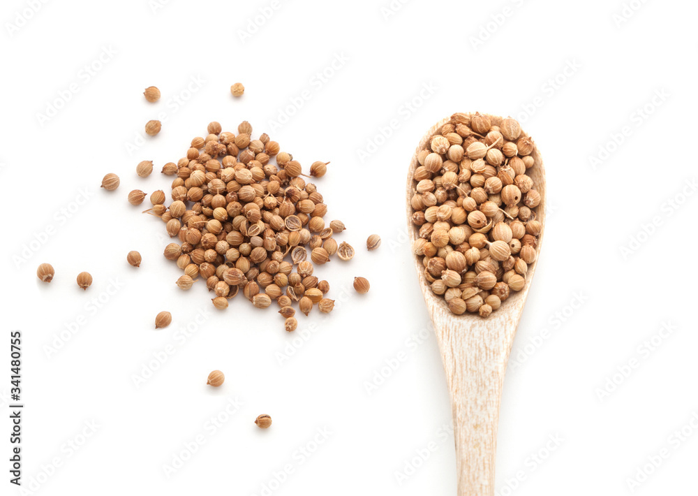 Coriander seeds spices in wooden spoon isolated on white background Coriander seeds spices in wooden spoon isolated on white background