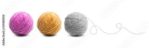 Different color balls of threads wool yarn isolated on white photo