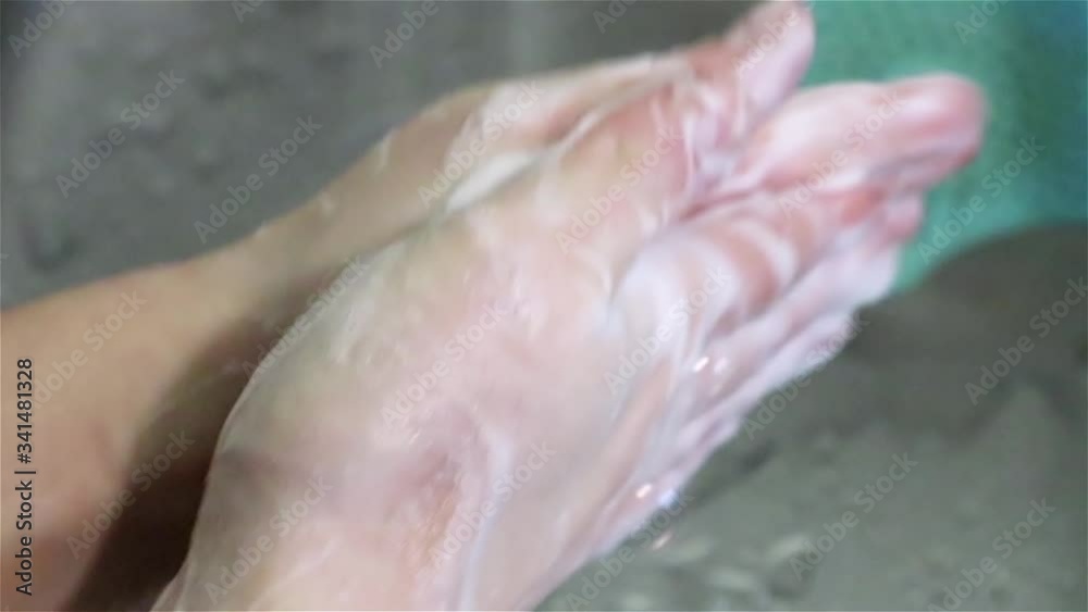 Wash hands with soap close up with metal sink and running water drops background. Cleaning body personal hygiene care Wash hands with soap close up with metal sink and running water drops background. Cleaning body personal hygiene care
