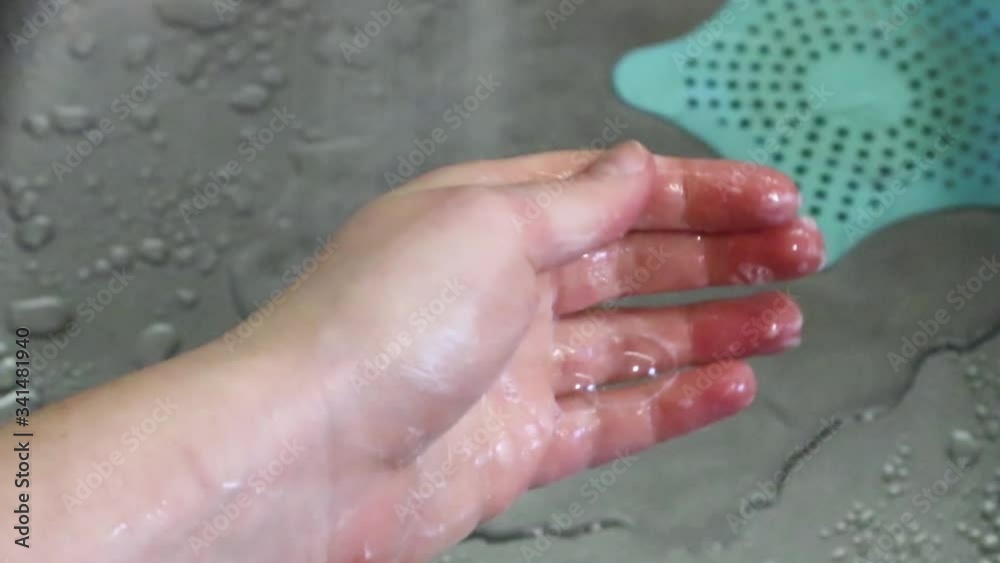 Wash hands with soap close up with metal sink and running water drops background. Cleaning body personal hygiene care Wash hands with soap close up with metal sink and running water drops background. Cleaning body personal hygiene care