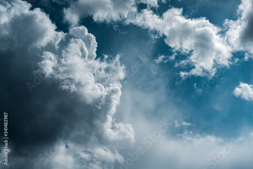 Dramatic sky with stormy clouds. The combination of light and dark clouds. Color trends.
