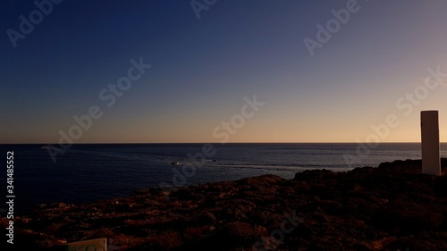 Sunset photos at beachfront oceans edge  island silhouettes