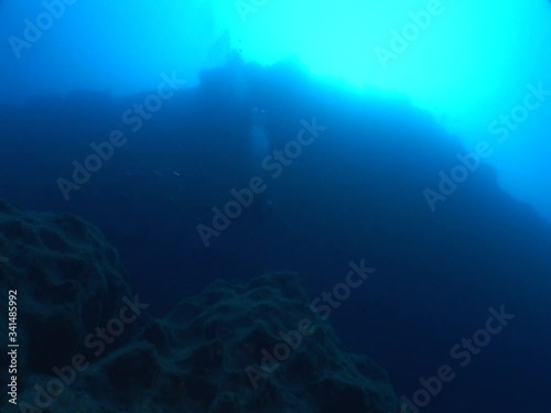 Wallpaper Mural scuba diver underwater exploring the reefs and rocks underwater tunnels and scenery of rocks and landscape ocean scenery Torontodigital.ca