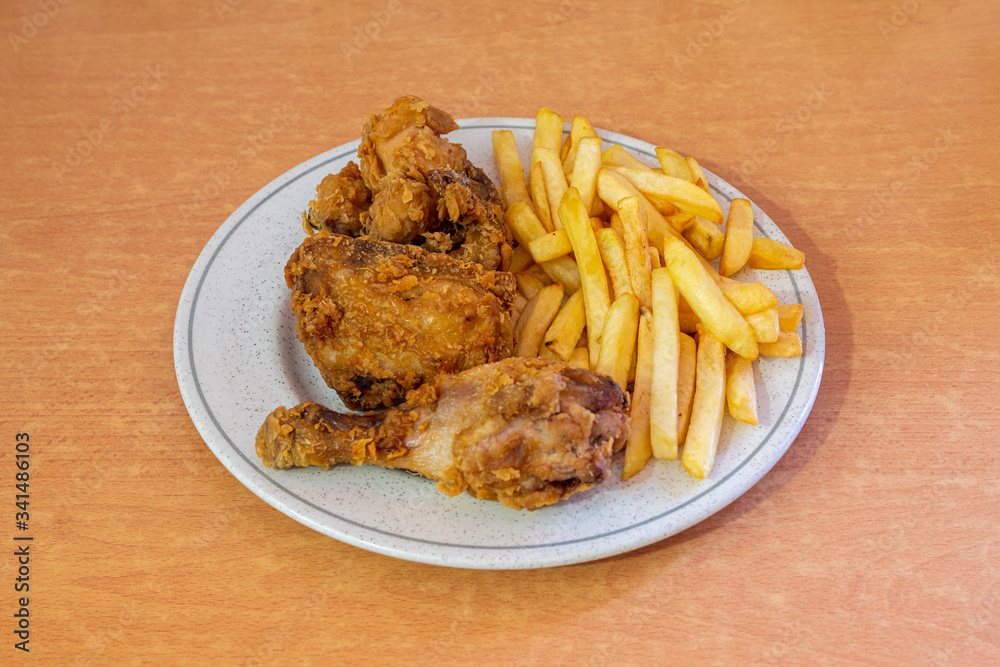 Pieces of battered chicken with garnish Pieces of battered chicken with garnish