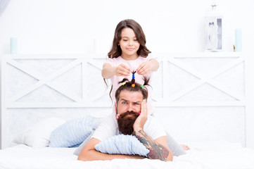 Thats OK. happy fathers day. family. Fathers day with daughter at home. Daughter creating fathers hair. Handsome father with little girl. Happy father and daughter. little girl love her daddy